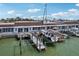 Home with boat dock and boat lift to enjoy a waterfront lifestyle, along with back patio and sliding glass doors at 467 Boca Ciega Point S Blvd, St Petersburg, FL 33708