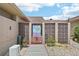 Charming gated courtyard with decorative tile, potted plants and access to outdoor seating at 467 Boca Ciega Point S Blvd, St Petersburg, FL 33708