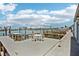 Waterfront view of boat dock with patio furniture, with beautiful water view at 467 Boca Ciega Point S Blvd, St Petersburg, FL 33708