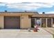 Charming exterior of a townhouse with a private entrance and attached garage at 467 Boca Ciega Point S Blvd, St Petersburg, FL 33708