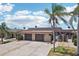 Beautiful single-story home featuring a two-car garage and well-maintained landscaping at 467 Boca Ciega Point S Blvd, St Petersburg, FL 33708