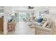 Open living area with stylish furnishings and a seamless transition to the outdoor space and waterfront at 467 Boca Ciega Point S Blvd, St Petersburg, FL 33708