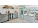 Entertaining space with wet bar, wine cooler, sliders to a patio and view of boat dock at 467 Boca Ciega Point S Blvd, St Petersburg, FL 33708