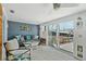 Inviting living room with waterfront views, comfortable seating and nautical decor at 467 Boca Ciega Point S Blvd, St Petersburg, FL 33708