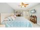 Spacious main bedroom with a ceiling fan and a dedicated desk area at 467 Boca Ciega Point S Blvd, St Petersburg, FL 33708