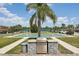 Community outdoor grill area with shuffleboard courts for leisure and entertainment at 467 Boca Ciega Point S Blvd, St Petersburg, FL 33708