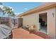 Enclosed patio with tiled flooring, grill and access to laundry room and outdoor area at 467 Boca Ciega Point S Blvd, St Petersburg, FL 33708