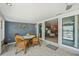 Relaxing sunroom offers views of the ocean and an entertaining dining table at 467 Boca Ciega Point S Blvd, St Petersburg, FL 33708