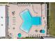 Aerial view of a unique swimming pool with ample seating and patio space at 467 Boca Ciega Point S Blvd, St Petersburg, FL 33708