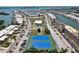 Aerial view of community tennis courts, parking, and shuffleboard courts surrounded by residential properties at 467 Boca Ciega Point S Blvd, St Petersburg, FL 33708