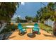 Relaxing backyard featuring a pool, lush greenery, and comfortable seating area with tropical views at 4681 Carson Ne St, St Petersburg, FL 33703