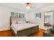 Serene bedroom with a neutral color palette, wood floors, and bright windows with shutter style blinds at 4681 Carson Ne St, St Petersburg, FL 33703