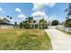 A quaint, single-story home with a well-kept lawn and white fence, offering curb appeal and privacy at 4681 Carson Ne St, St Petersburg, FL 33703