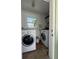 Practical laundry room with stacked washer and dryer for efficient space saving and convenience at 4681 Carson Ne St, St Petersburg, FL 33703