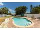 Inviting in-ground pool with clear blue water, and patio surround with relaxing lounge chairs at 4681 Carson Ne St, St Petersburg, FL 33703