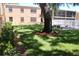 Landscaped backyard with green grass and a white fenced patio area at 4725 Joseph Ct # 233, Tampa, FL 33614