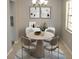 Bright dining area featuring modern décor, a round table, chandelier, and a window with natural light at 4725 Joseph Ct # 233, Tampa, FL 33614