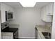 Functional kitchen featuring white cabinets, granite countertops, stainless steel appliances and recessed lighting at 4725 Joseph Ct # 233, Tampa, FL 33614