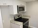Modern kitchen featuring granite countertops and stainless steel appliances at 4725 Joseph Ct # 233, Tampa, FL 33614