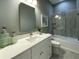 Elegant bathroom with a white vanity, vessel sink, and a tiled shower with a glass door at 4920 72Nd N St, St Petersburg, FL 33709