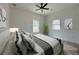 Cozy bedroom featuring a ceiling fan, ample natural light, and contemporary decor at 4920 72Nd N St, St Petersburg, FL 33709
