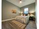 Well-lit bedroom with a comfortable bed, stylish rug, and natural light from the window at 4920 72Nd N St, St Petersburg, FL 33709