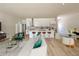 Open-concept living room flows into the kitchen with a large island and modern appliances at 4920 72Nd N St, St Petersburg, FL 33709