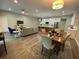 Bright, open-concept living room and kitchen with hardwood floors and modern finishes create a welcoming atmosphere at 4920 72Nd N St, St Petersburg, FL 33709