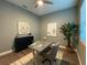 Home office with a modern desk, comfortable chair, decorative artwork, and ample natural light at 4920 72Nd N St, St Petersburg, FL 33709