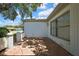 View of the exterior back patio with brick floor with ample room for entertaining at 5042 Gaston St, Spring Hill, FL 34607