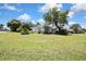 Expansive front lawn with view of the home showcasing its curb appeal at 5042 Gaston St, Spring Hill, FL 34607