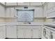 This kitchen offers classic white cabinets, modern appliances, and plenty of counter space at 5042 Gaston St, Spring Hill, FL 34607