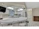 Spacious kitchen features a breakfast bar, white appliances, and ample countertop space at 5042 Gaston St, Spring Hill, FL 34607