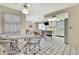 Bright kitchen with tiled floor and white cabinets, perfect for cooking and dining at 5042 Gaston St, Spring Hill, FL 34607