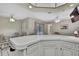 The kitchen area features a breakfast bar and seamless flow to the dining and living spaces at 5042 Gaston St, Spring Hill, FL 34607