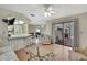 Open-concept area with kitchen bar, a cozy seating area, and easy access to the outdoor patio at 5042 Gaston St, Spring Hill, FL 34607