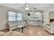 Cozy living room with a comfortable sofa, a glass coffee table, and views of the kitchen at 5042 Gaston St, Spring Hill, FL 34607