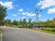 Community garden with windmill, raised beds, garden boxes and lush landscaping provides a farm to table lifestyle at 5043 Night Star Trl, Odessa, FL 33556