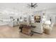 Open floor plan featuring the kitchen, living room with fireplace and TV, and dining area at 5043 Night Star Trl, Odessa, FL 33556