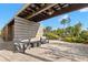 Community outdoor lounge area with modern outdoor seating and a vintage windmill at 5043 Night Star Trl, Odessa, FL 33556