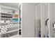 Organized pantry with ample shelving, storing various household goods and cleaning supplies at 5043 Night Star Trl, Odessa, FL 33556