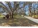 Scenic park view featuring mature trees, a walking path, and lush greenery, offering a tranquil escape at 5043 Night Star Trl, Odessa, FL 33556