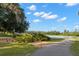 A peaceful walking path and bench overlook the community lake, offering a serene retreat at 5043 Night Star Trl, Odessa, FL 33556