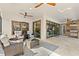 Covered patio with seating area, outdoor kitchen, and seamless access to the indoors at 5043 Night Star Trl, Odessa, FL 33556