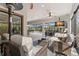 Beautiful covered patio overlooking the pool, equipped with comfortable seating and ceiling fans at 5043 Night Star Trl, Odessa, FL 33556