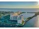 Beautiful aerial view of waterfront condos with boat docks and community pool at 6009 Sea Ranch Dr # 107E, Hudson, FL 34667