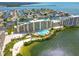 Stunning aerial view of condo complex with waterfront access, boat docks and a swimming pool at 6009 Sea Ranch Dr # 107E, Hudson, FL 34667