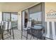 Balcony with seating offers a perfect spot to unwind and enjoy beach views and easy access to living area at 6009 Sea Ranch Dr # 107E, Hudson, FL 34667