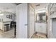 Bathroom with white cabinets, granite countertop, and access to a bedroom area and a shower/tub combo at 6009 Sea Ranch Dr # 107E, Hudson, FL 34667