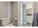 Bright bathroom view to the granite counters and white cabinets of the vanity at 6009 Sea Ranch Dr # 107E, Hudson, FL 34667